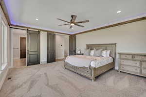 Bedroom with carpet, recessed lighting, a barn door, and ceiling fan