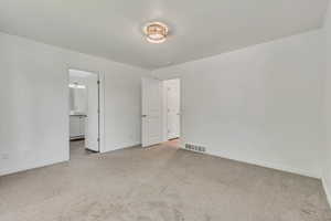Unfurnished room featuring carpet flooring and baseboards