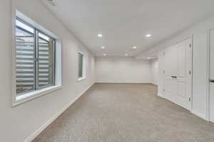 Below grade area featuring carpet and recessed lighting