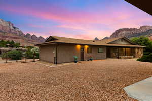View of front facade with a mountain view and stucco siding
