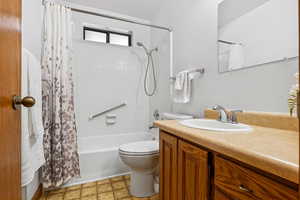 Full bathroom with vanity and shower / tub combo