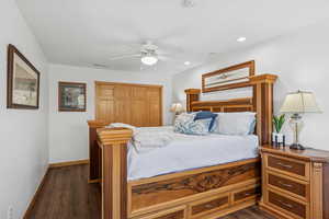 Bedroom featuring dark wood-style flooring, a closet, a ceiling fan, and recessed lighting