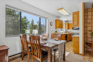 Dining room featuring a baseboard radiator and wine cooler