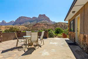 View of patio / terrace with outdoor dining area and a mountain view