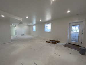 Basement featuring recessed lighting