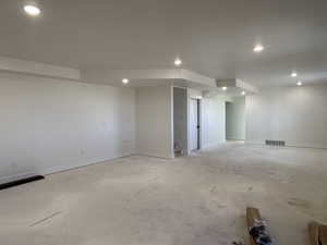 Below grade area with recessed lighting and baseboards