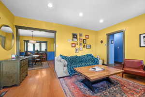 Living room featuring light wood-type flooring and recessed lighting