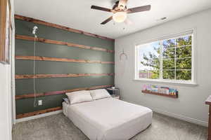 Bedroom featuring carpet flooring and a ceiling fan