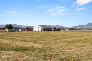 Back area/field view of workshop with a mountain view and a rural view