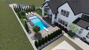 View of swimming pool featuring a diving board and a patio