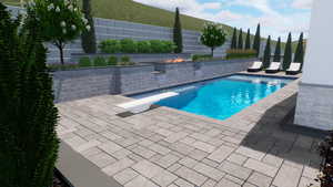 View of swimming pool with a diving board, a patio area, and an outdoor fire pit
