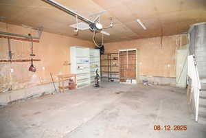 Garage featuring a garage door opener