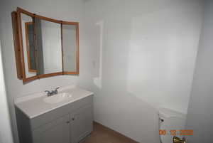 Bathroom featuring vanity and toilet and tub/shower