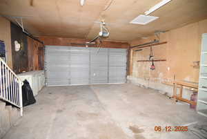 Garage featuring a garage door opener
