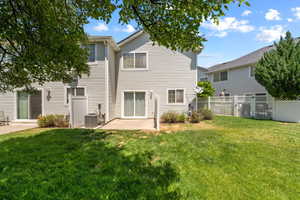 Rear view of property featuring a patio area