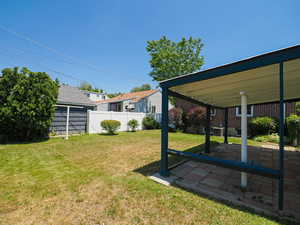 View of yard with a patio