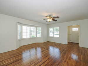 Spare room featuring ceiling fan and wood finished floors