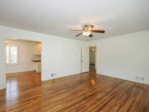 Unfurnished room featuring wood finished floors and ceiling fan