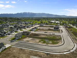 Aerial perspective of suburban area featuring a mountainous background