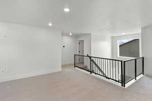 Living room with carpet floors and recessed lighting