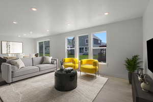 Living room featuring light wood-style flooring and recessed lighting