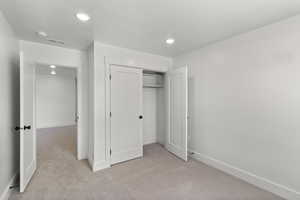 Bedroom with carpet and recessed lighting