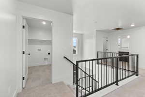 Hall featuring an upstairs landing, recessed lighting, carpet, attic access, and healthy amount of natural light