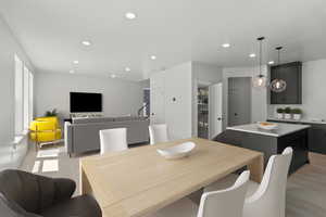 Dining room featuring light wood-style floors and recessed lighting