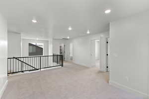 Living room with carpet floors and recessed lighting