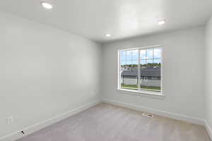 Bedroom with carpet and recessed lighting