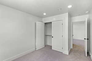 Bedroom with carpet and recessed lighting