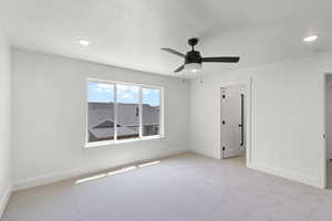 Bedroom featuring recessed lighting and a ceiling fan