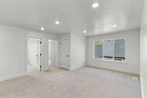 Living room with carpet floors and recessed lighting