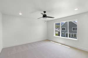 Bedroom featuring recessed lighting and a ceiling fan