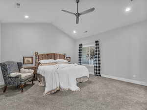 Carpeted bedroom featuring recessed lighting, vaulted ceiling, and a ceiling fan