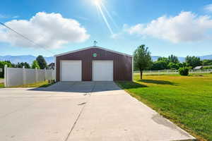 Detached garage featuring a mountain view