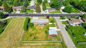 Aerial overview of property's location with nearby suburban area