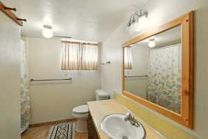 Full bathroom with vanity and tile patterned flooring