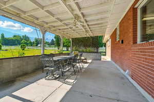 View of patio / terrace with a mountain view and outdoor dining area