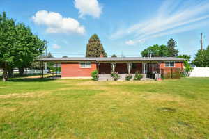 Back of property with brick siding