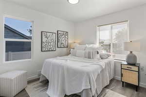 Bedroom with radiator and wood finished floors
