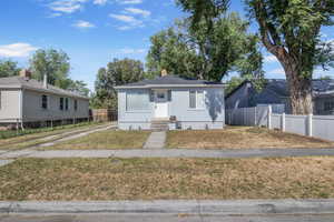 Bungalow-style home with board and batten siding and a chimney
