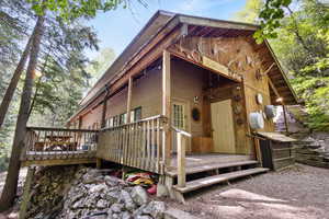 Doorway to property featuring a deck