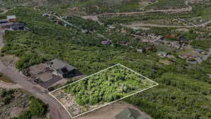 Aerial view of property and surrounding area with property parcel outlined