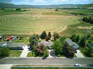 Overview of rural landscape and field behind the home