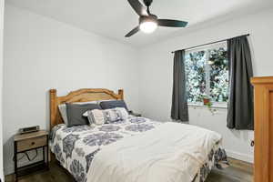 Bedroom with wood finished floors and a ceiling fan
