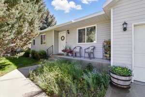 Property entrance with covered porch