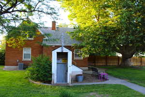 Back of house featuring root cellar with power connected