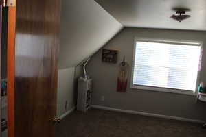 Bedroom/Bonus room with lofted ceiling and carpet floors