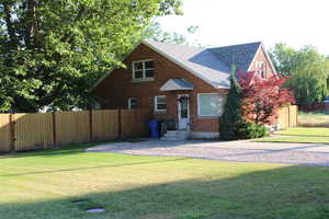 East view of front of home with kitchen entry.